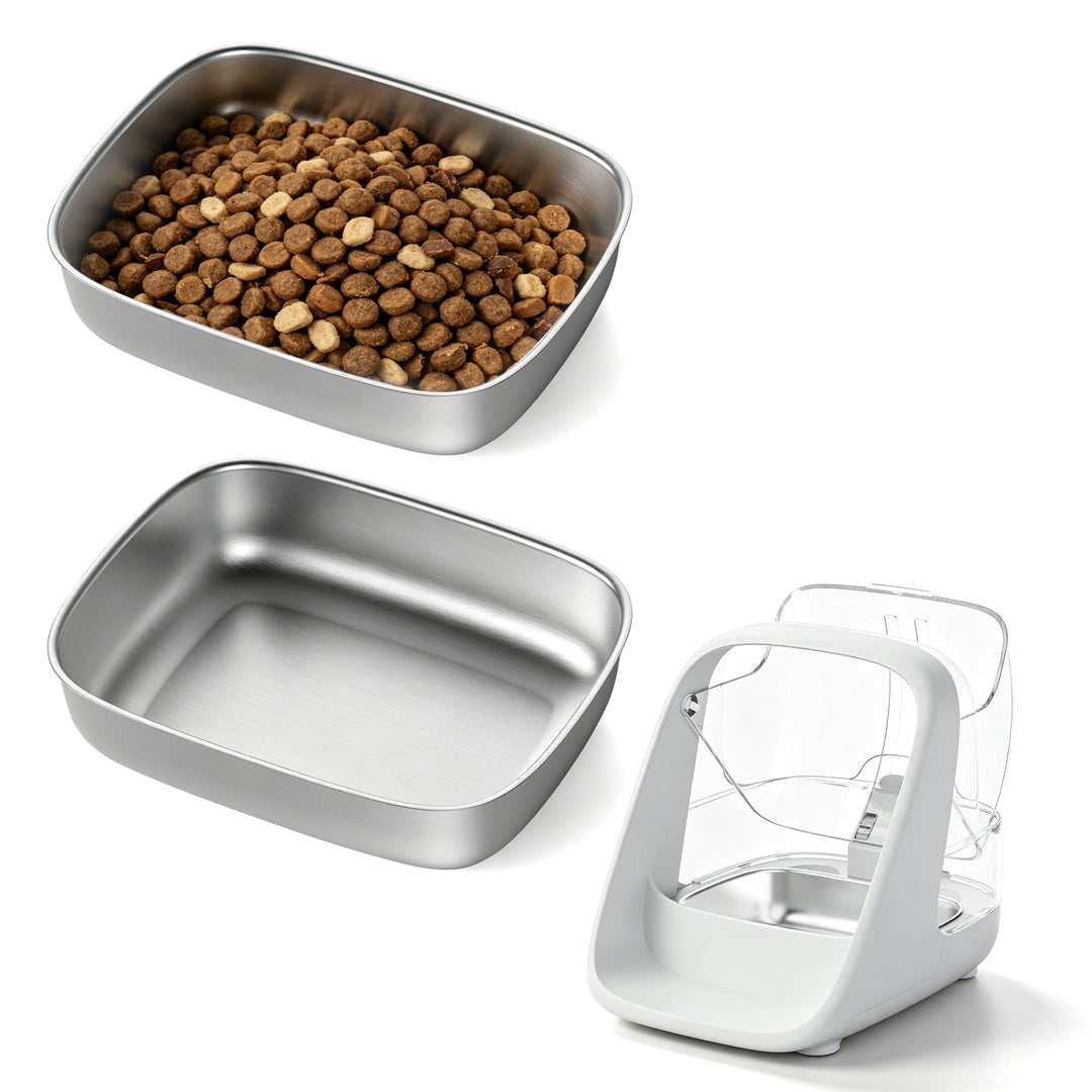 Two stainless steel replacement bowls, one containing kibble, with an ePawDen microchip pet feeder shown for fit reference